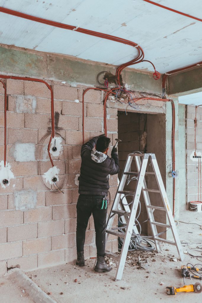 Electrician running new wiring during a home renovation