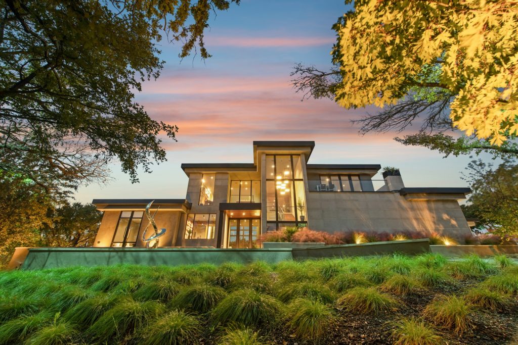 Modern house with exterior lighting at dusk